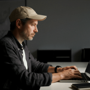 Man working on his laptop looking very focused